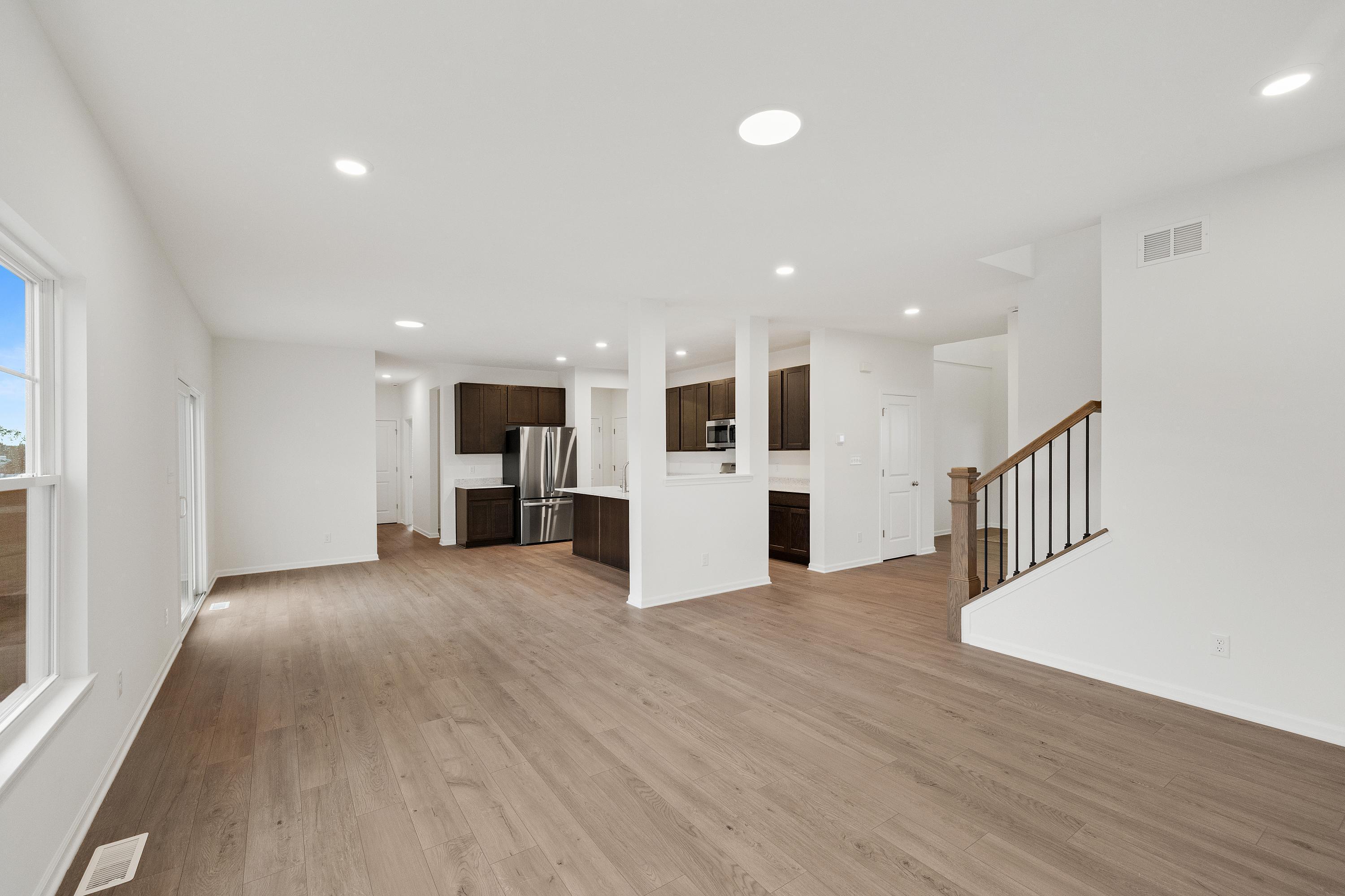13080 Carolina Street Crown Point, IN 46307 - Photo 2 of 23 a view of a kitchen with a sink and wooden floor