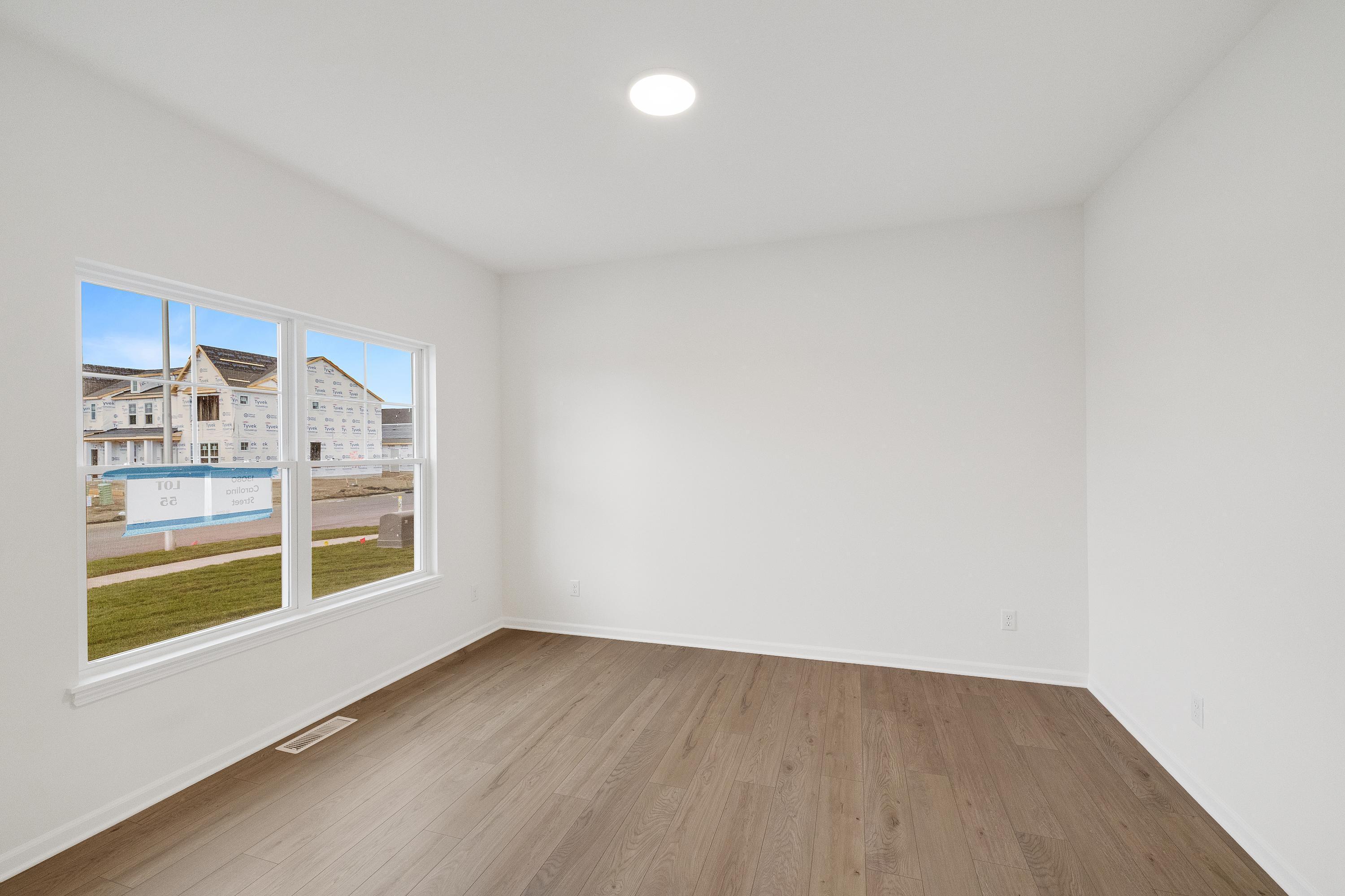 13080 Carolina Street Crown Point, IN 46307 - Photo 4 of 23 a view of an empty room with a window