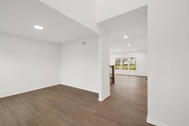 a view of a kitchen with wooden floor