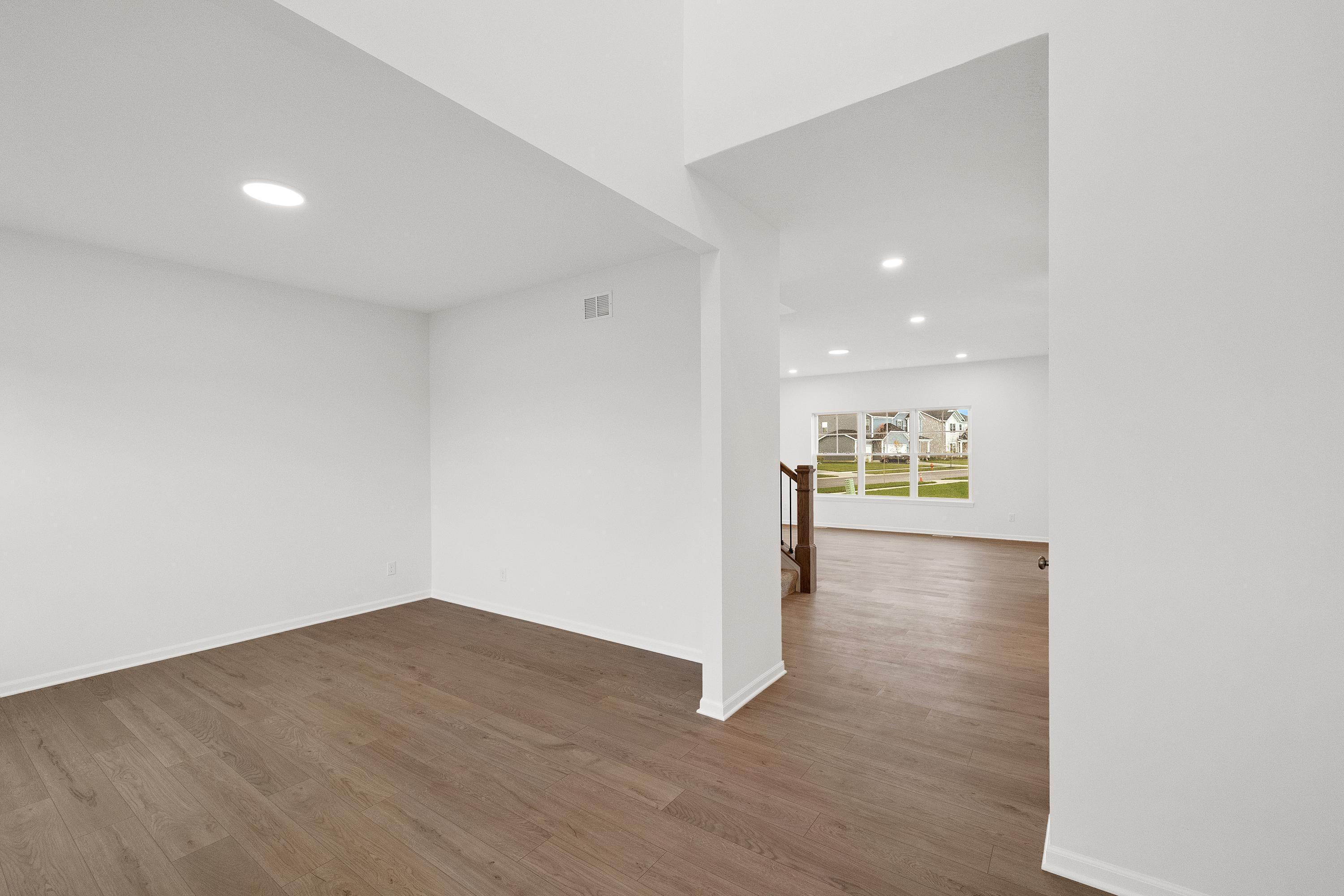 13080 Carolina Street Crown Point, IN 46307 - Photo 5 of 23 a view of a kitchen with wooden floor