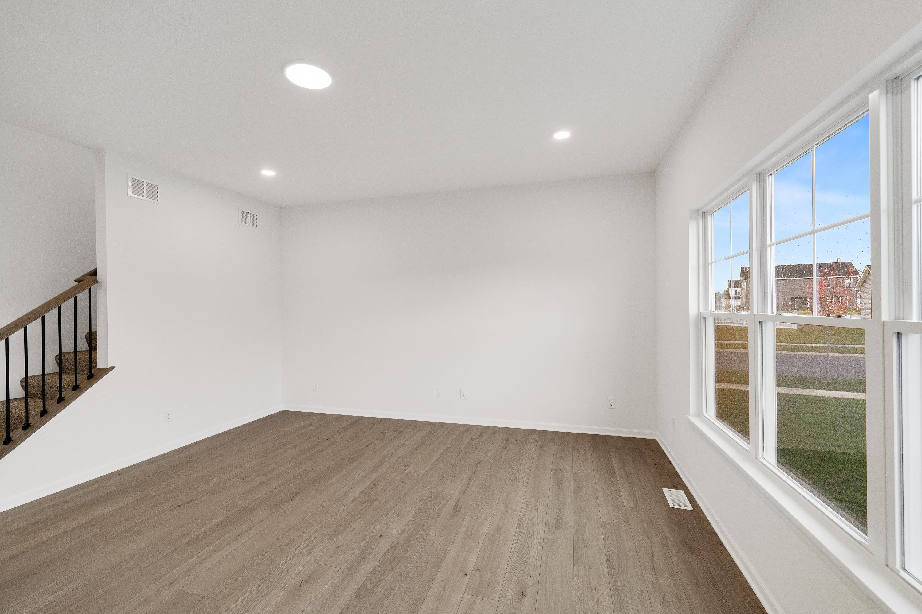 13080 Carolina Street Crown Point, IN 46307 - Photo 6 of 23 wooden floor in an empty room with a window