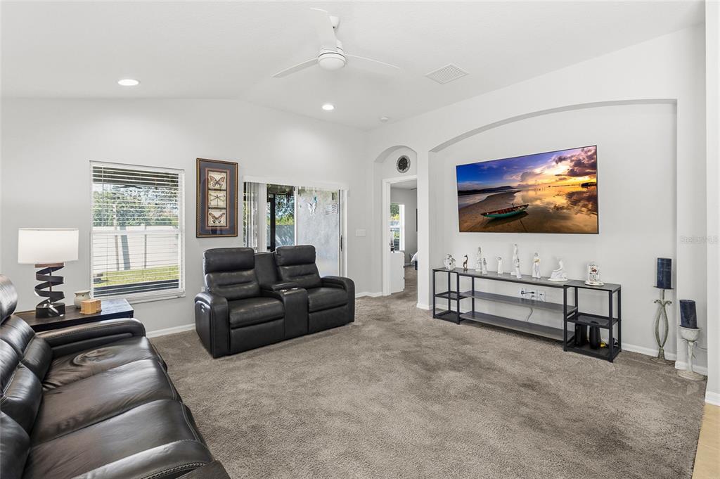 6641 Boulder Run Loop Wesley Chapel, FL 33545 - Photo 15 of 43 a living room with furniture and a flat screen tv