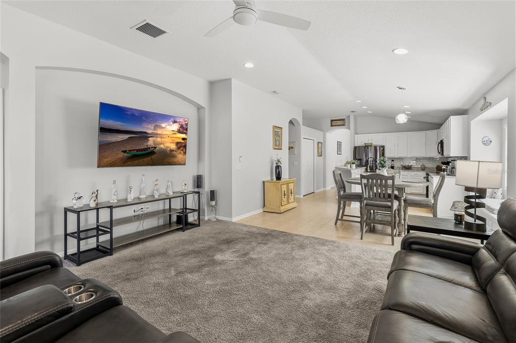 6641 Boulder Run Loop Wesley Chapel, FL 33545 - Photo 16 of 43 a living room with furniture and a flat screen tv