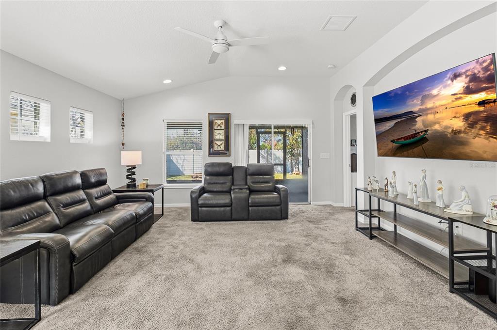 6641 Boulder Run Loop Wesley Chapel, FL 33545 - Photo 17 of 43 a living room with furniture and a flat screen tv