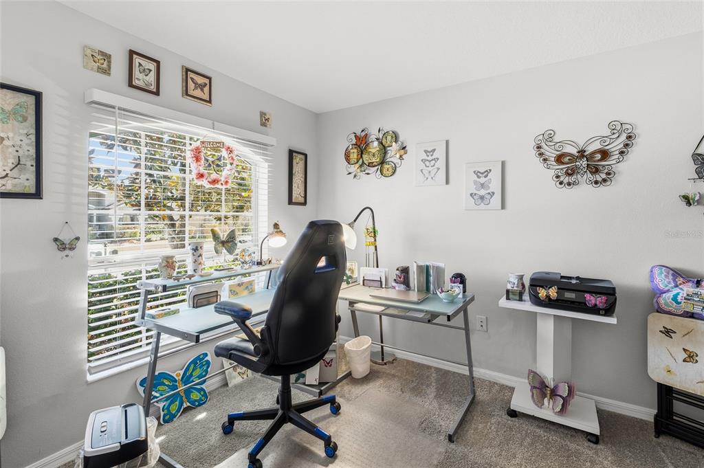 6641 Boulder Run Loop Wesley Chapel, FL 33545 - Photo 31 of 43 a view of a workspace with furniture and a window