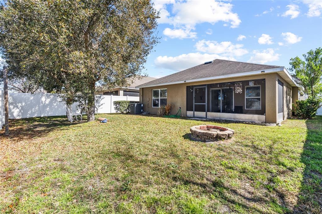 6641 Boulder Run Loop Wesley Chapel, FL 33545 - Photo 37 of 43 a view of a house with a yard