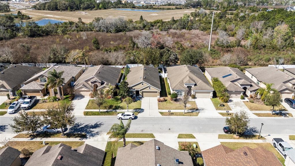 6641 Boulder Run Loop Wesley Chapel, FL 33545 - Photo 42 of 43 an aerial view of residential houses with outdoor space and swimming pool