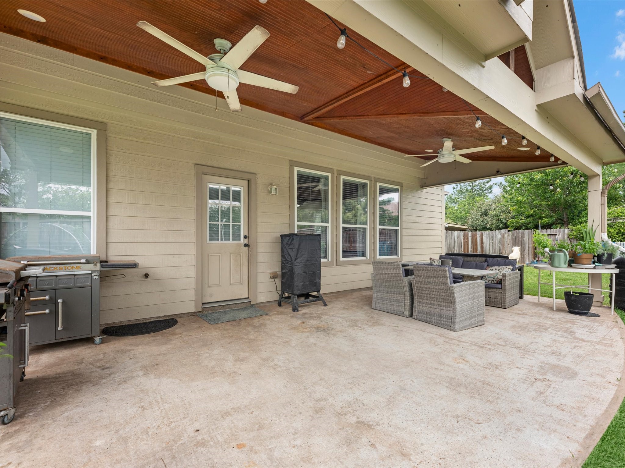 22422 Lamaster Lane Spring, TX 77373 - Photo 29 of 35 Covered patio with fans for added comfort during those hot Texas summer days.