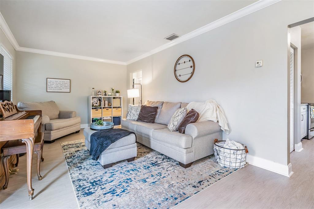 6985 Merrick Lane Spring Hill, FL 34606 - Photo 4 of 15 a living room with a couch and a table