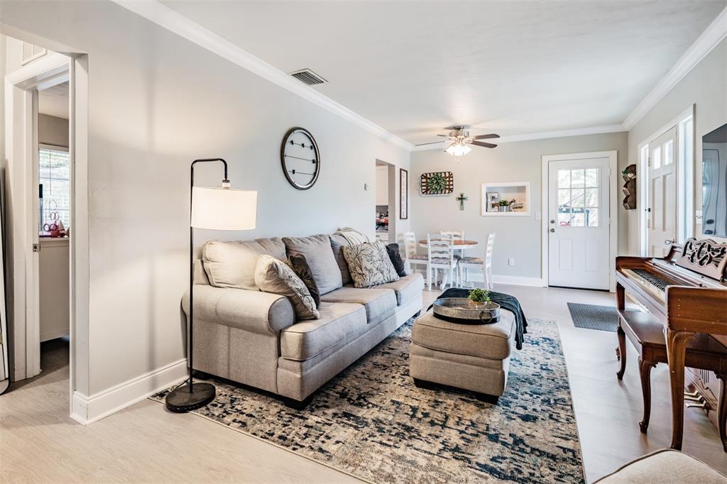 6985 Merrick Lane Spring Hill, FL 34606 - Photo 5 of 15 a living room with furniture and a window