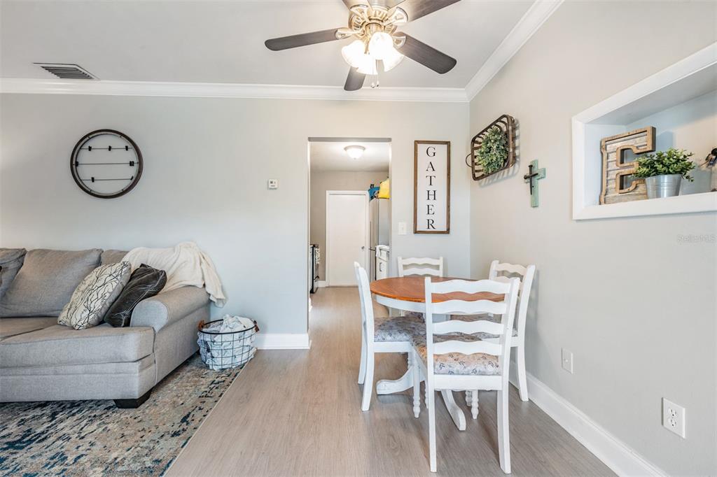 6985 Merrick Lane Spring Hill, FL 34606 - Photo 7 of 15 a living room with furniture and a window