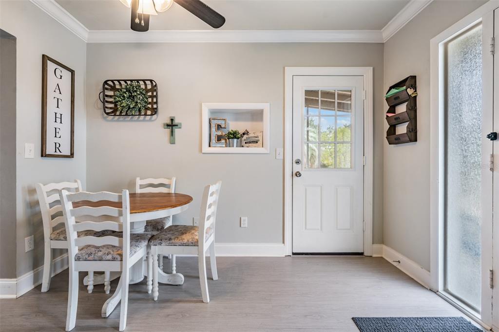 6985 Merrick Lane Spring Hill, FL 34606 - Photo 8 of 15 a view of a dining room with furniture and window