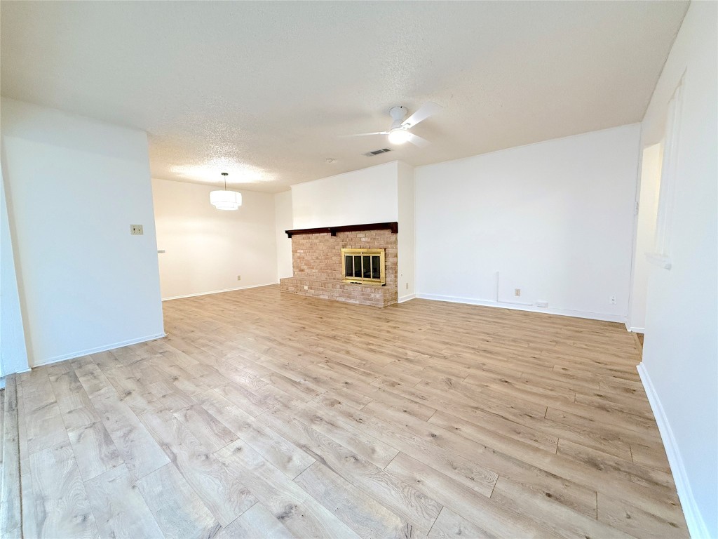 3607 Summit Bend, Unit B Austin, TX 78759 - Photo 15 of 24 a view of empty room with wooden floor