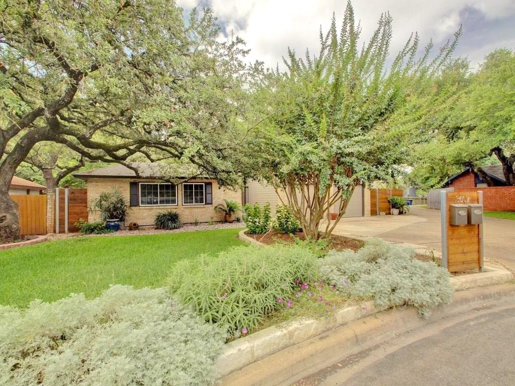 3607 Summit Bend, Unit B Austin, TX 78759 - Photo 2 of 24 a front view of a house with garden