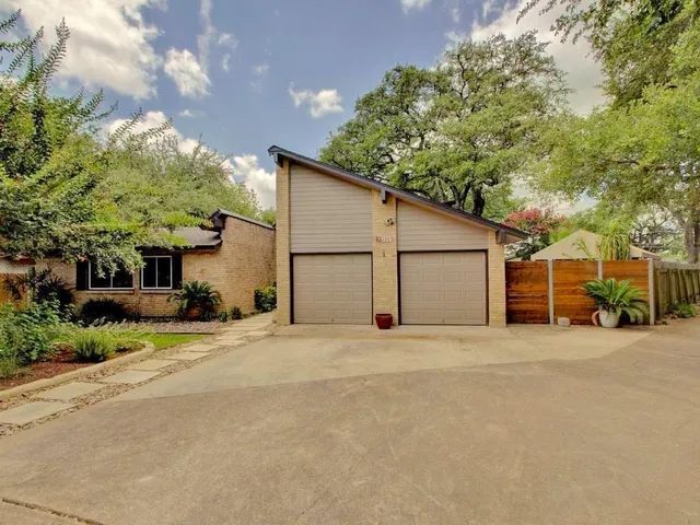 a view of a house with a outdoor space and street view