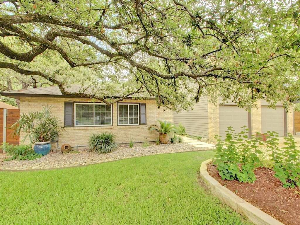 3607 Summit Bend, Unit B Austin, TX 78759 - Photo 4 of 24 a front view of a house with a yard