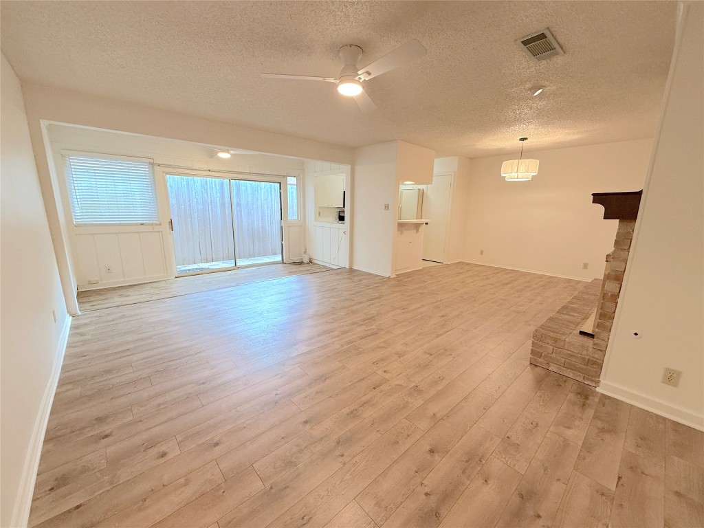 3607 Summit Bend, Unit B Austin, TX 78759 - Photo 6 of 24 an empty room with wooden floor and windows
