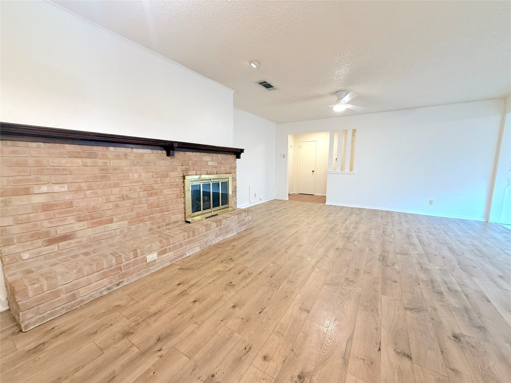 3607 Summit Bend, Unit B Austin, TX 78759 - Photo 8 of 24 a view of a livingroom with wooden floor and a window