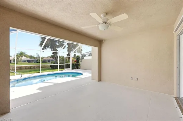 a view of a backyard with swimming pool