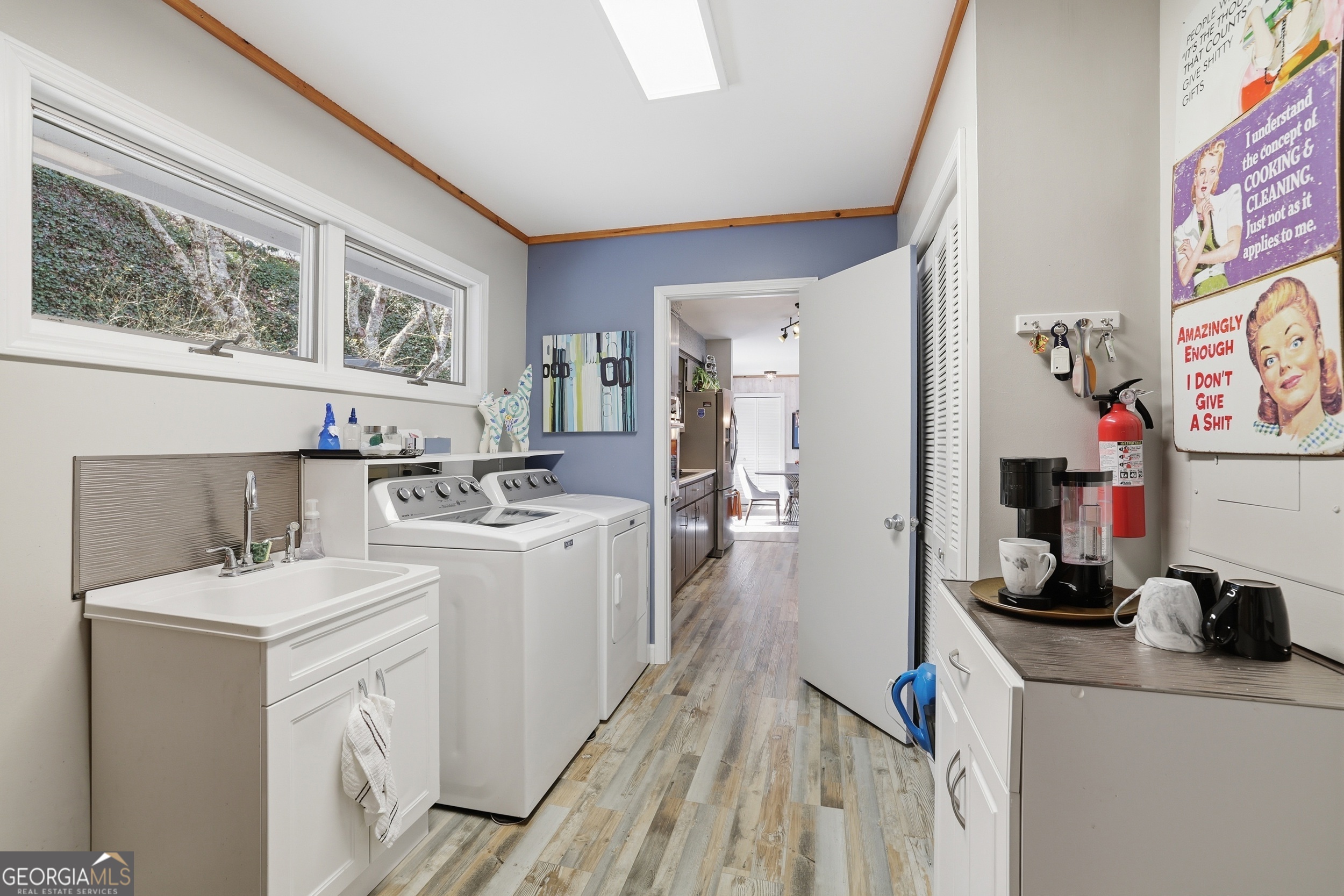 499 Ridgepole Drive Sky Valley, GA 30537 - Photo 13 of 58 a room with a sink a washer and dryer
