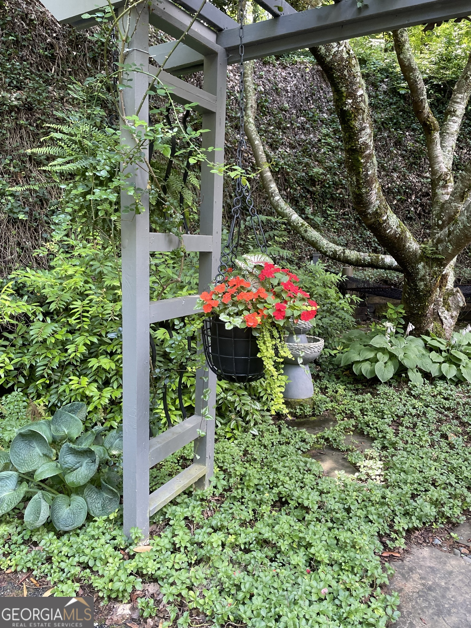 499 Ridgepole Drive Sky Valley, GA 30537 - Photo 25 of 58 a view of a house with a flower garden