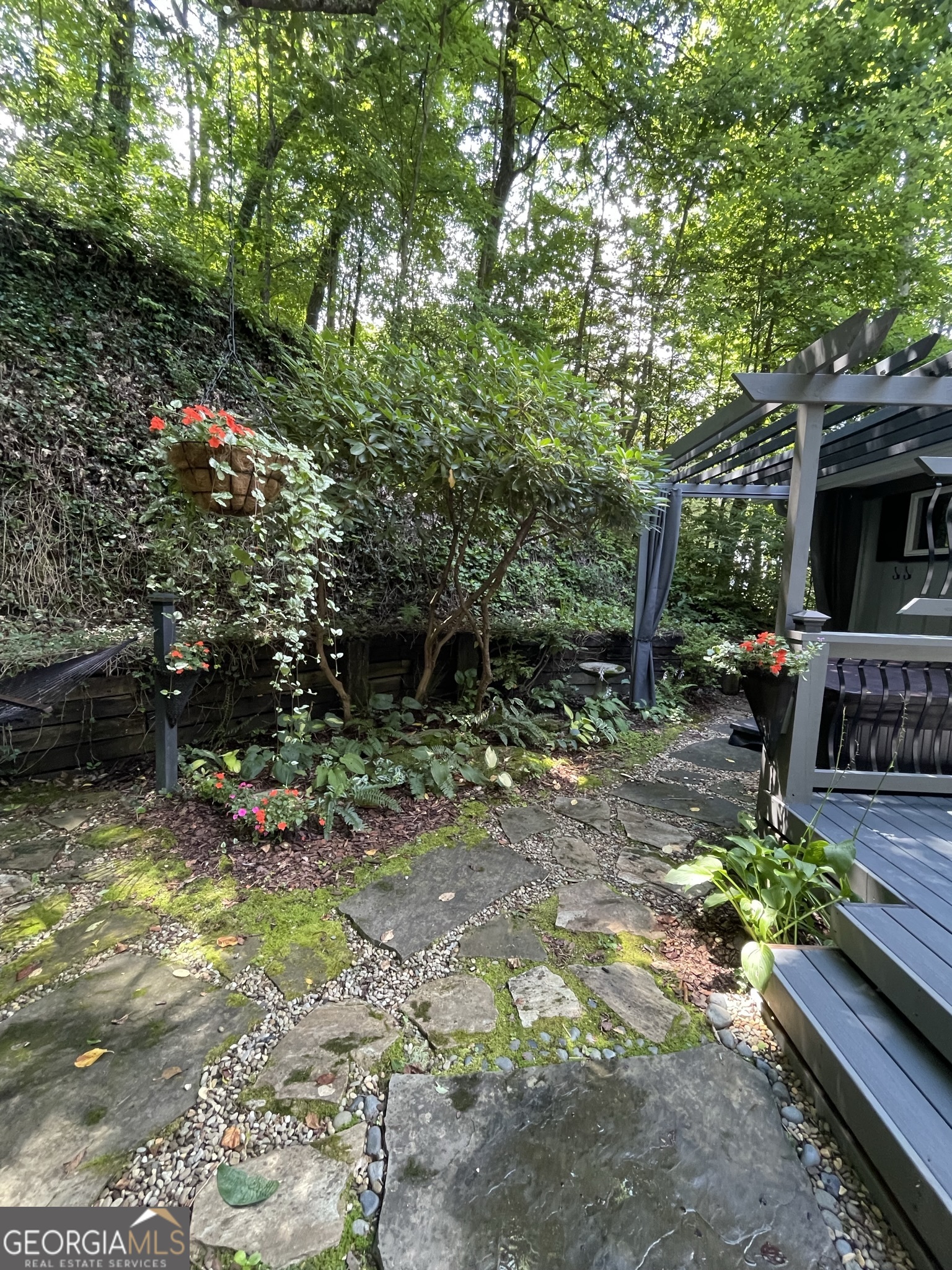 499 Ridgepole Drive Sky Valley, GA 30537 - Photo 26 of 58 a view of backyard with seating space and trees in the background