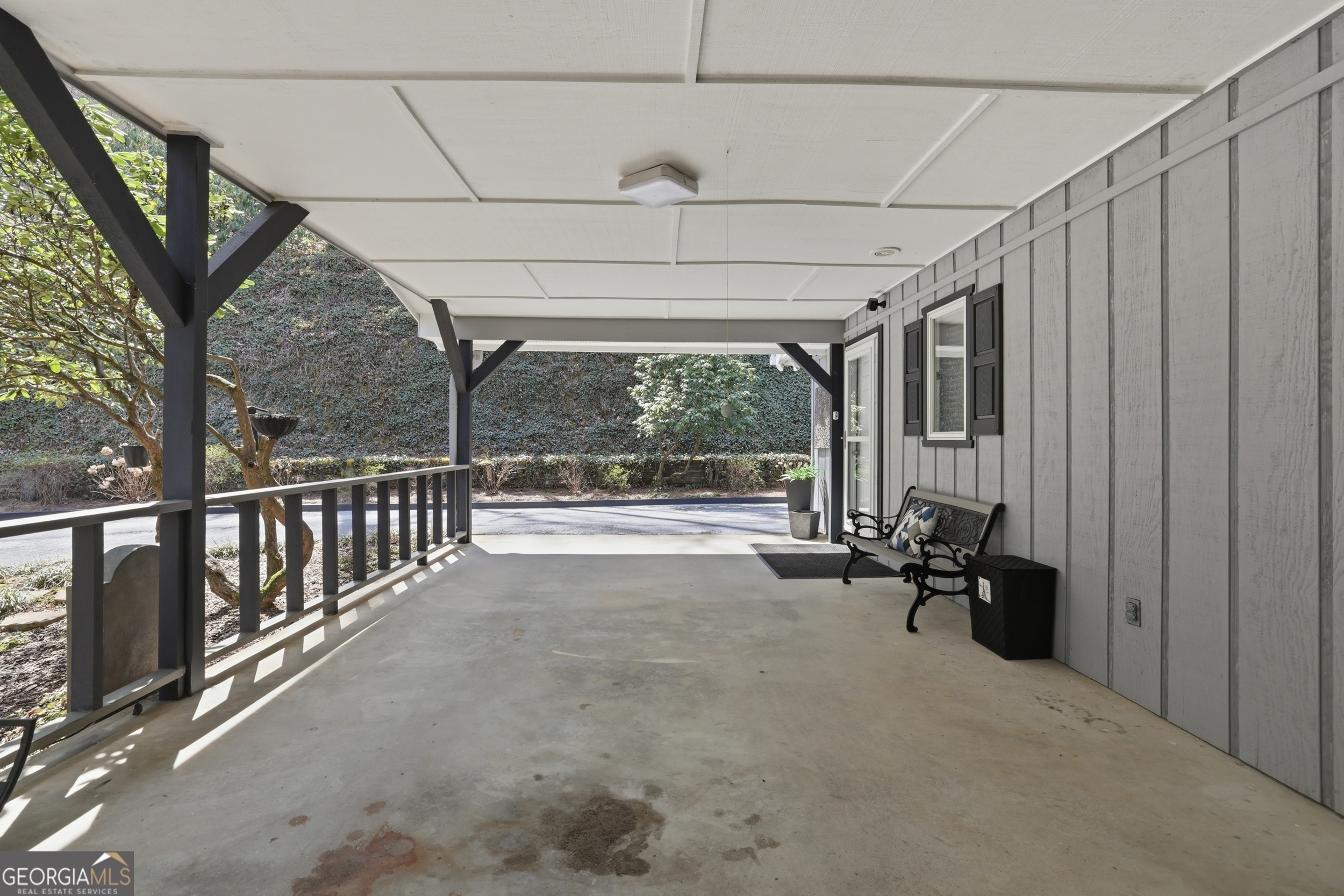 499 Ridgepole Drive Sky Valley, GA 30537 - Photo 46 of 58 a view of a porch with furniture and a gate