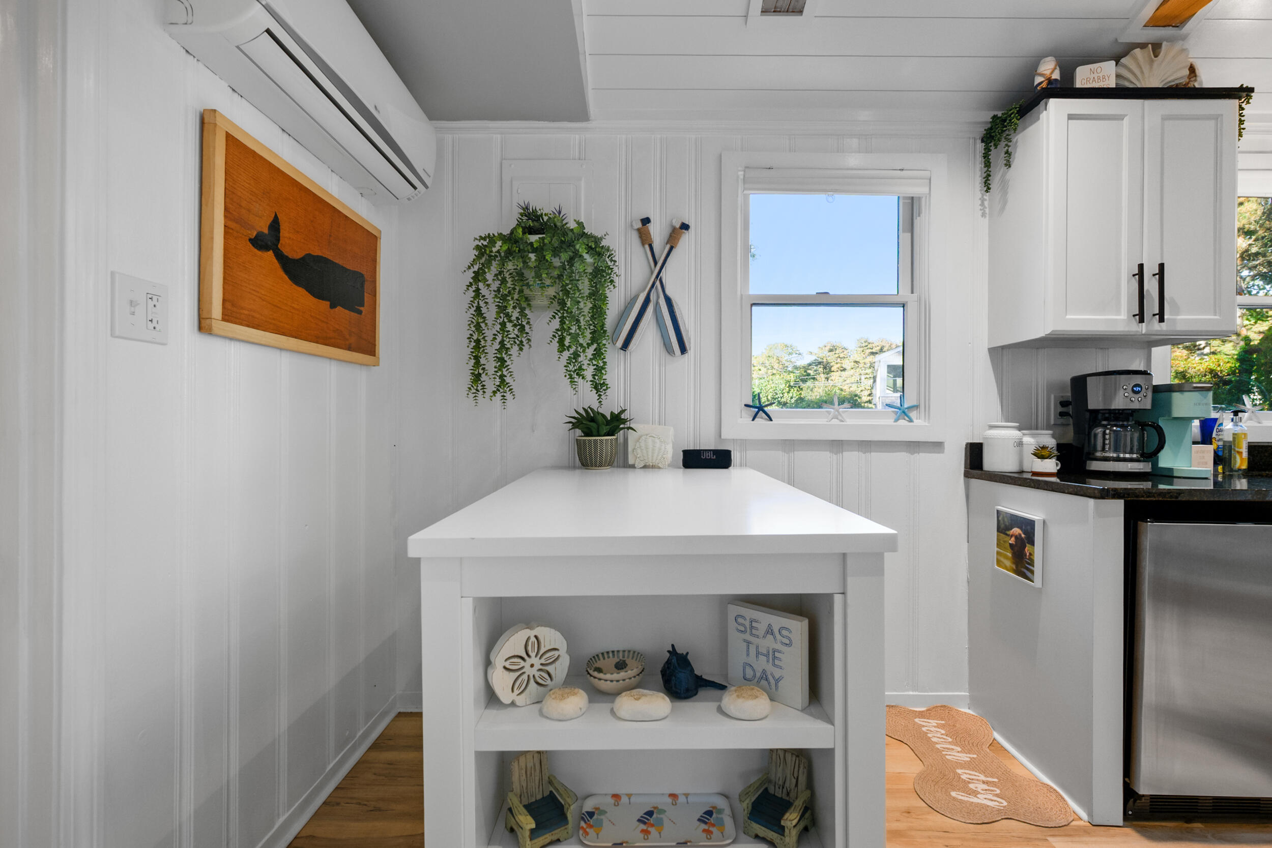 82 Shore Road, Unit 8 Truro, MA 02666 - Photo 14 of 40 a kitchen with a refrigerator and a more window