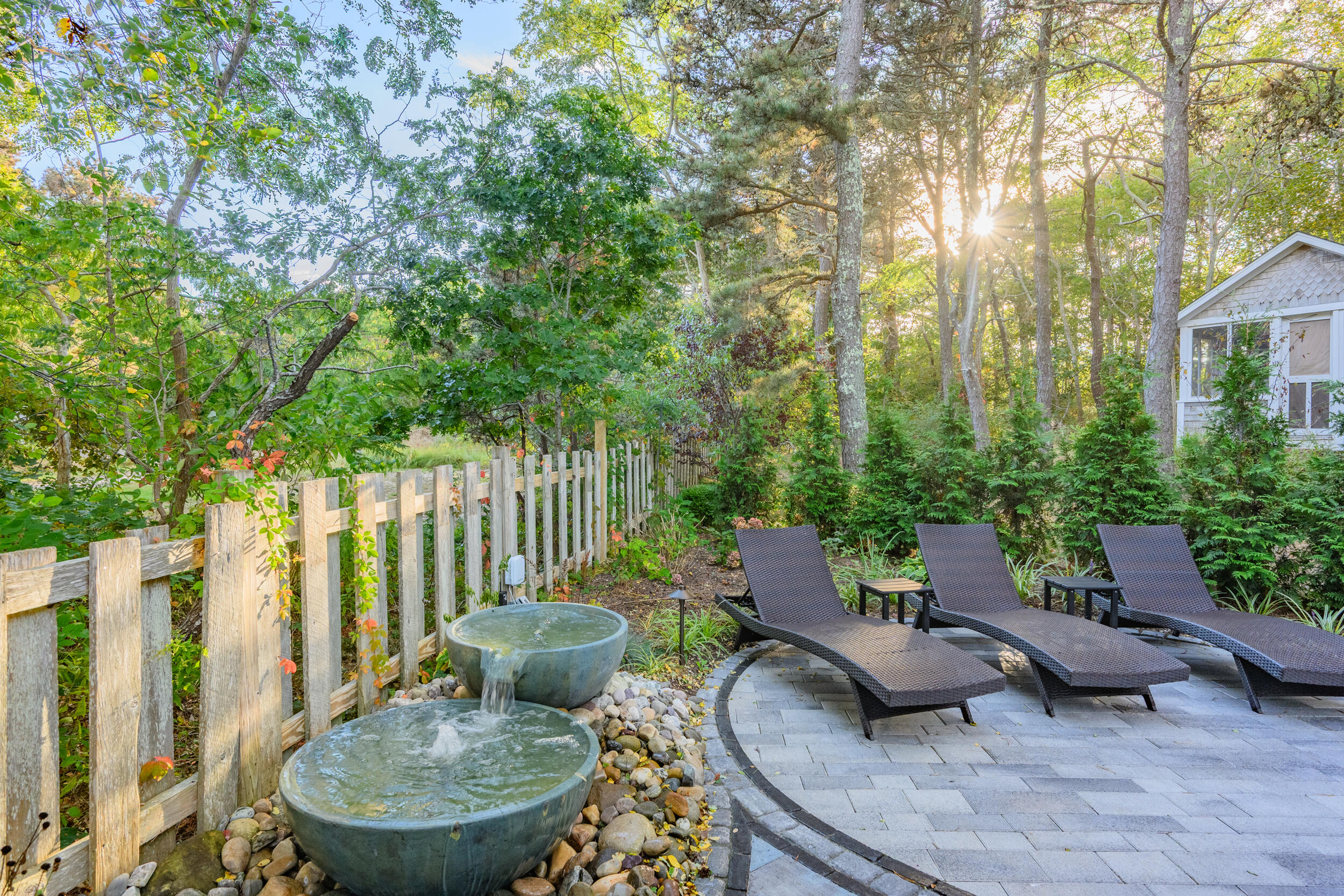 82 Shore Road, Unit 8 Truro, MA 02666 - Photo 26 of 40 a view of a chairs and table in backyard