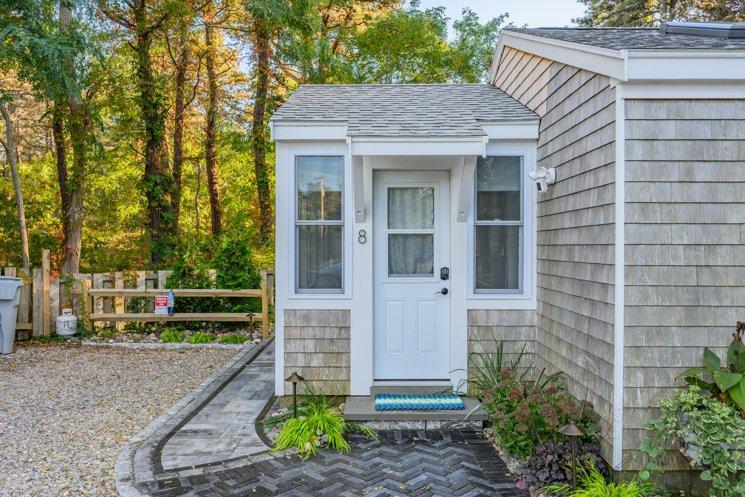 82 Shore Road, Unit 8 Truro, MA 02666 - Photo 4 of 40 a front view of a house with a garden