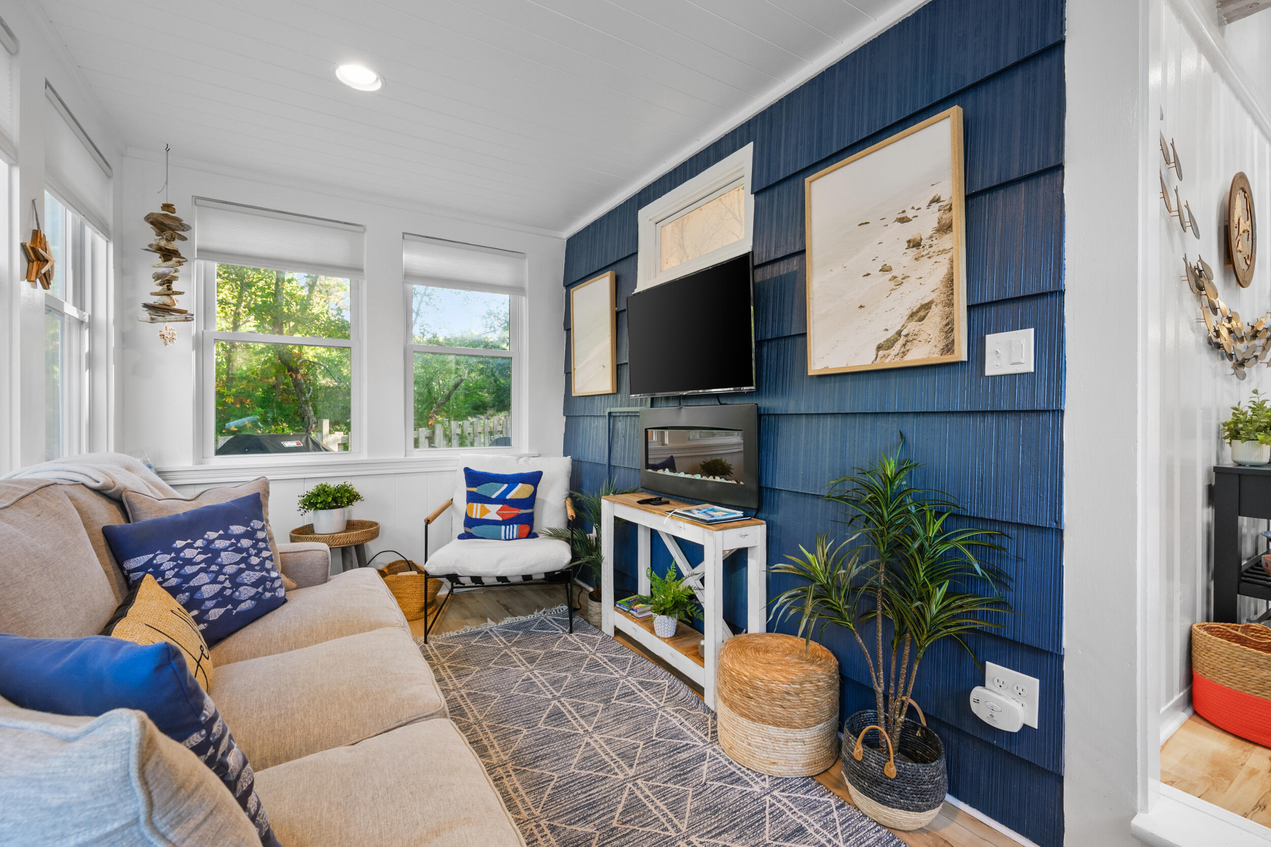 82 Shore Road, Unit 8 Truro, MA 02666 - Photo 6 of 40 a living room with furniture a window and a flat screen tv