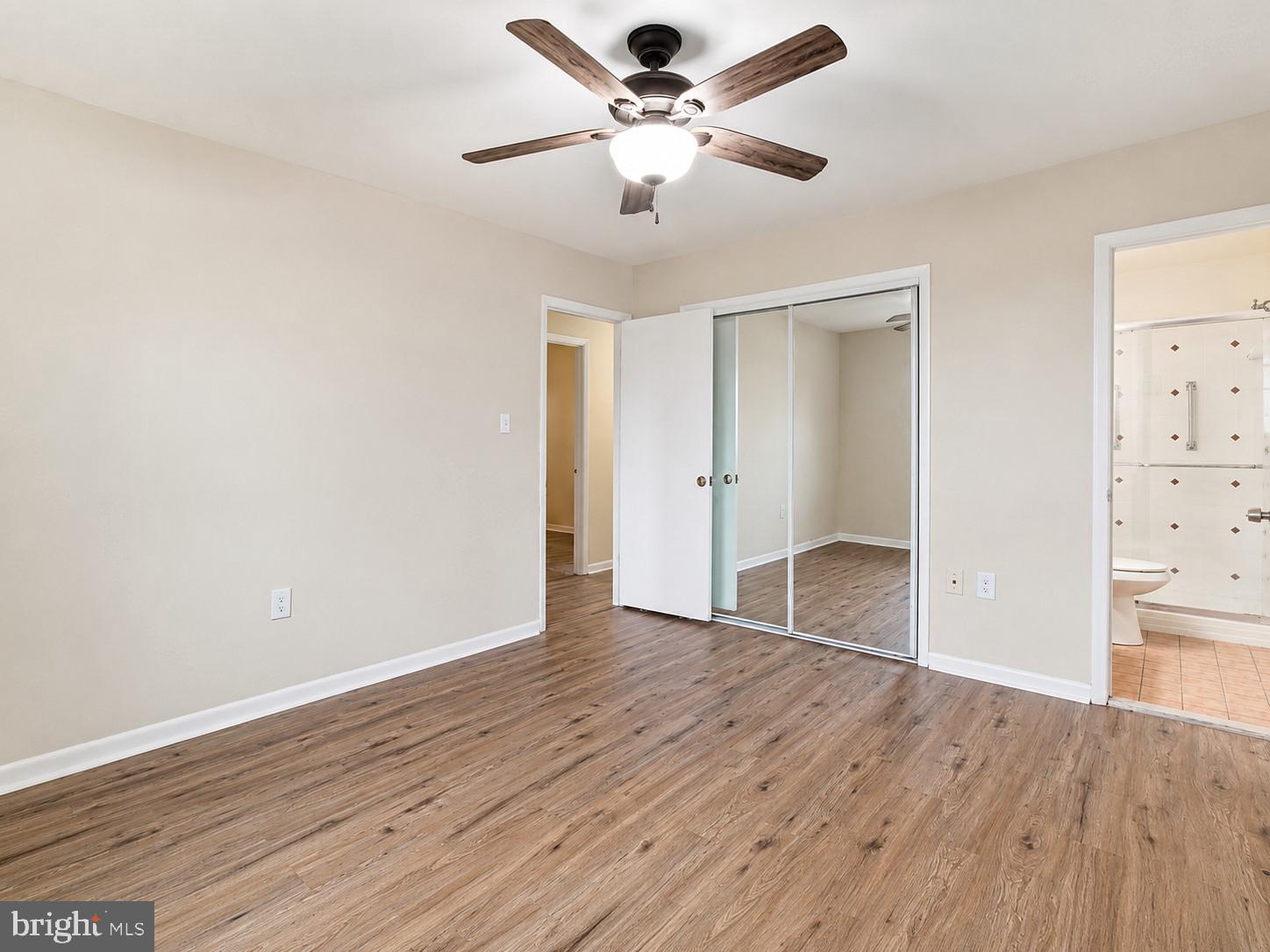 11312 Old Fort Road Fort Washington, MD 20744 - Photo 9 of 13 an empty room with wooden floor and windows
