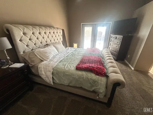 a bedroom with a bed and a table