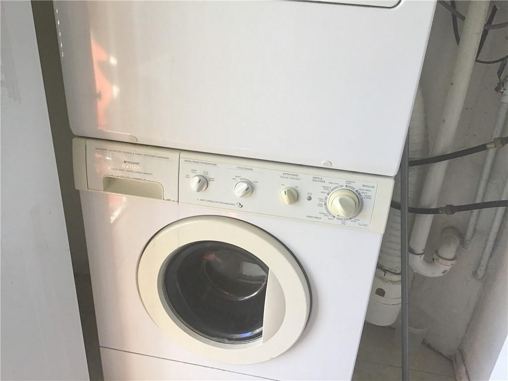 3551 Inverrary Drive, Unit 208 Lauderhill, FL 33319 - Photo 11 of 15 a utility room with dryer and washer