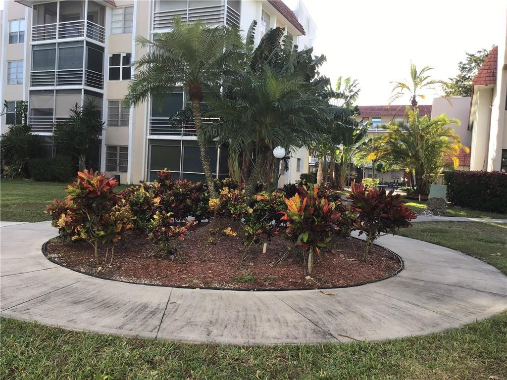 3551 Inverrary Drive, Unit 208 Lauderhill, FL 33319 - Photo 13 of 15 a view of outdoor space yard and house