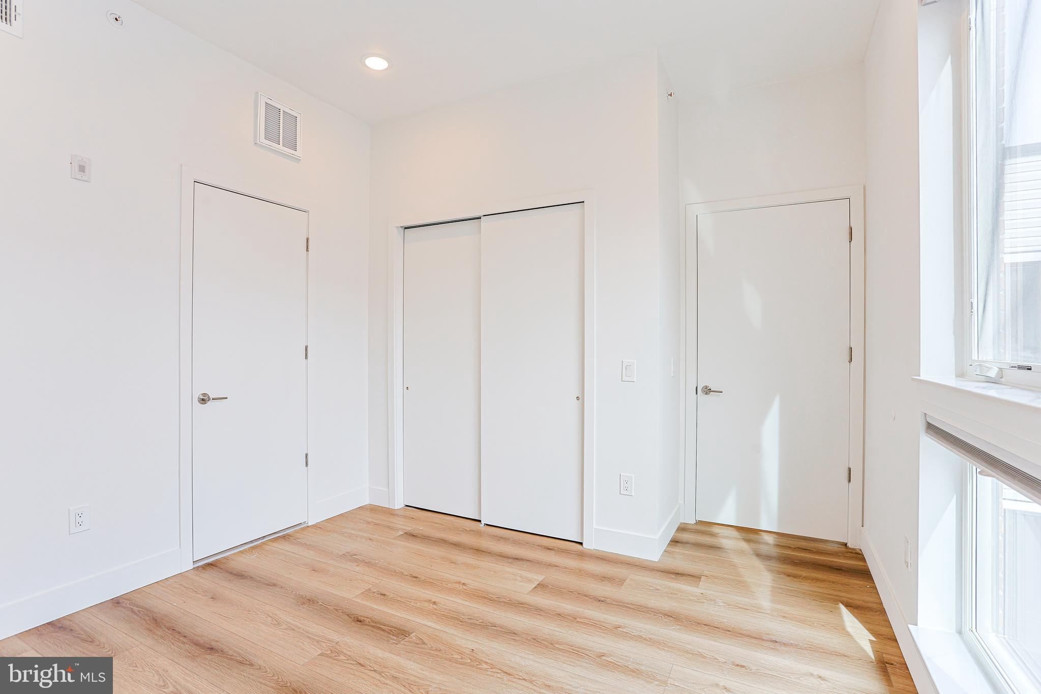 300 Christian Street, Unit 305 Philadelphia, PA 19147 - Photo 11 of 20 a view of empty room with wooden floor