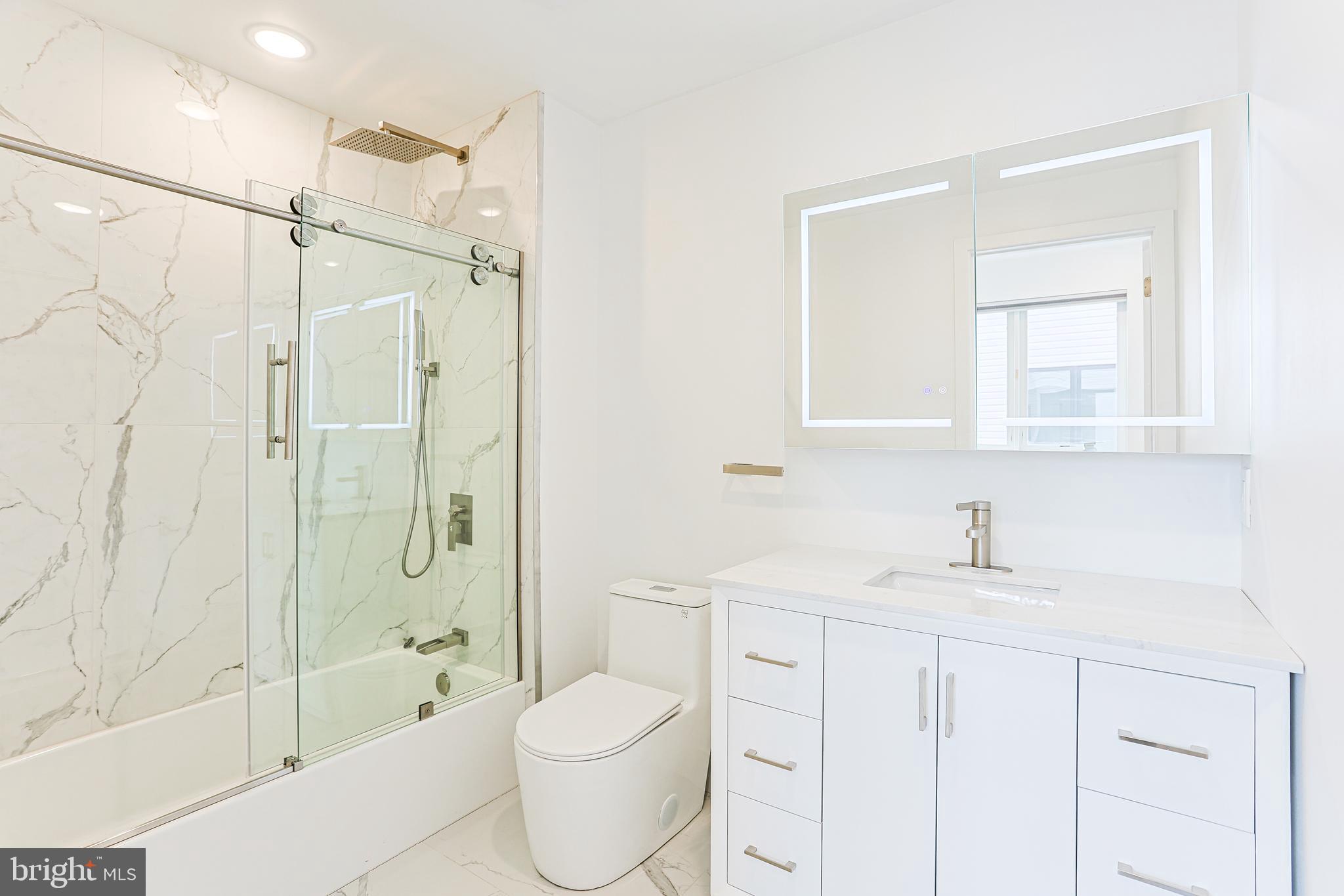300 Christian Street, Unit 305 Philadelphia, PA 19147 - Photo 13 of 20 a bathroom with a sink toilet a shower and a bathtub