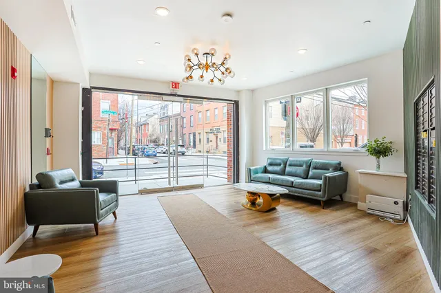 a living room with furniture and a large window