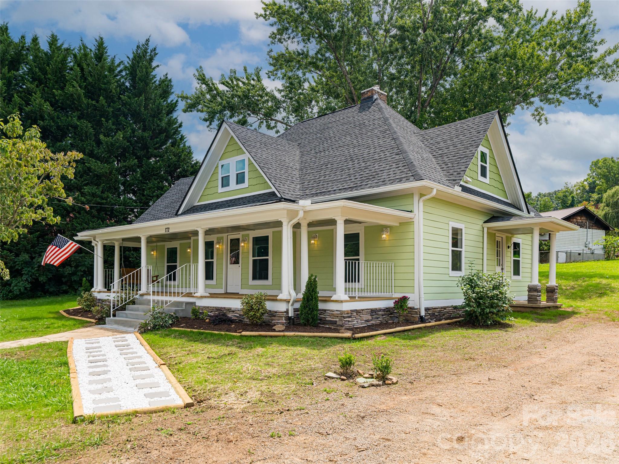 172 Reed Street Canton, NC 28716 - Photo 3 of 48 a front view of a house with garden