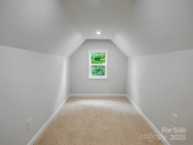 a front view of a house with a yard and outdoor seating