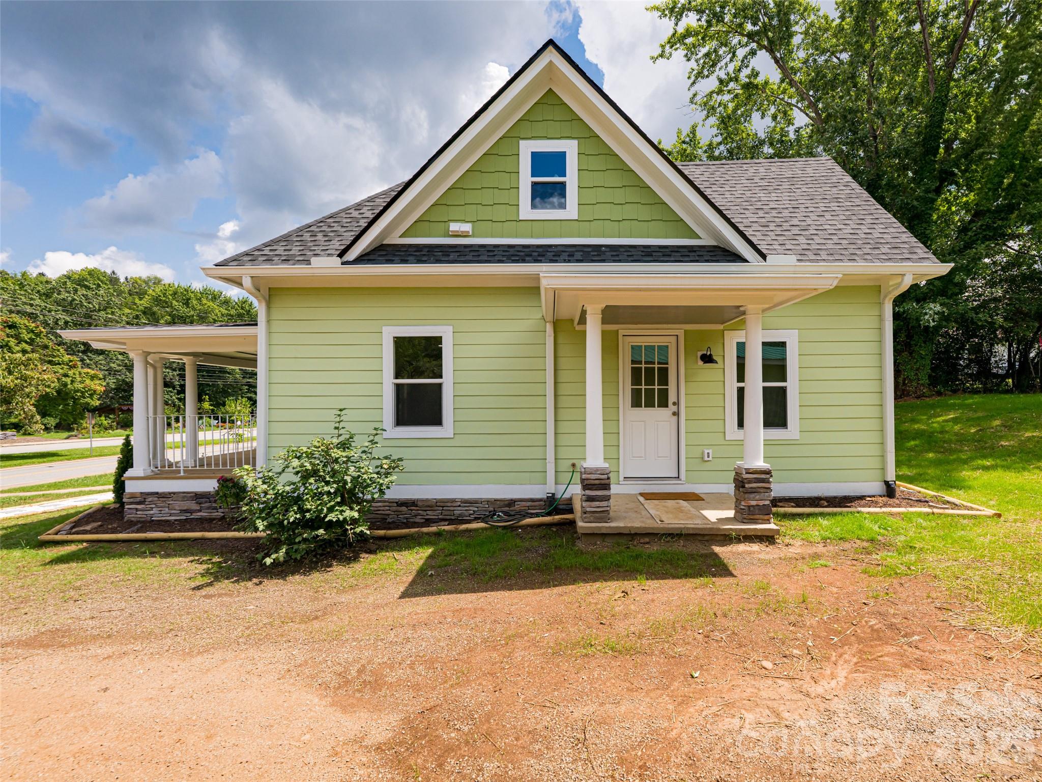 172 Reed Street Canton, NC 28716 - Photo 38 of 48 a front view of a house with a yard and outdoor seating