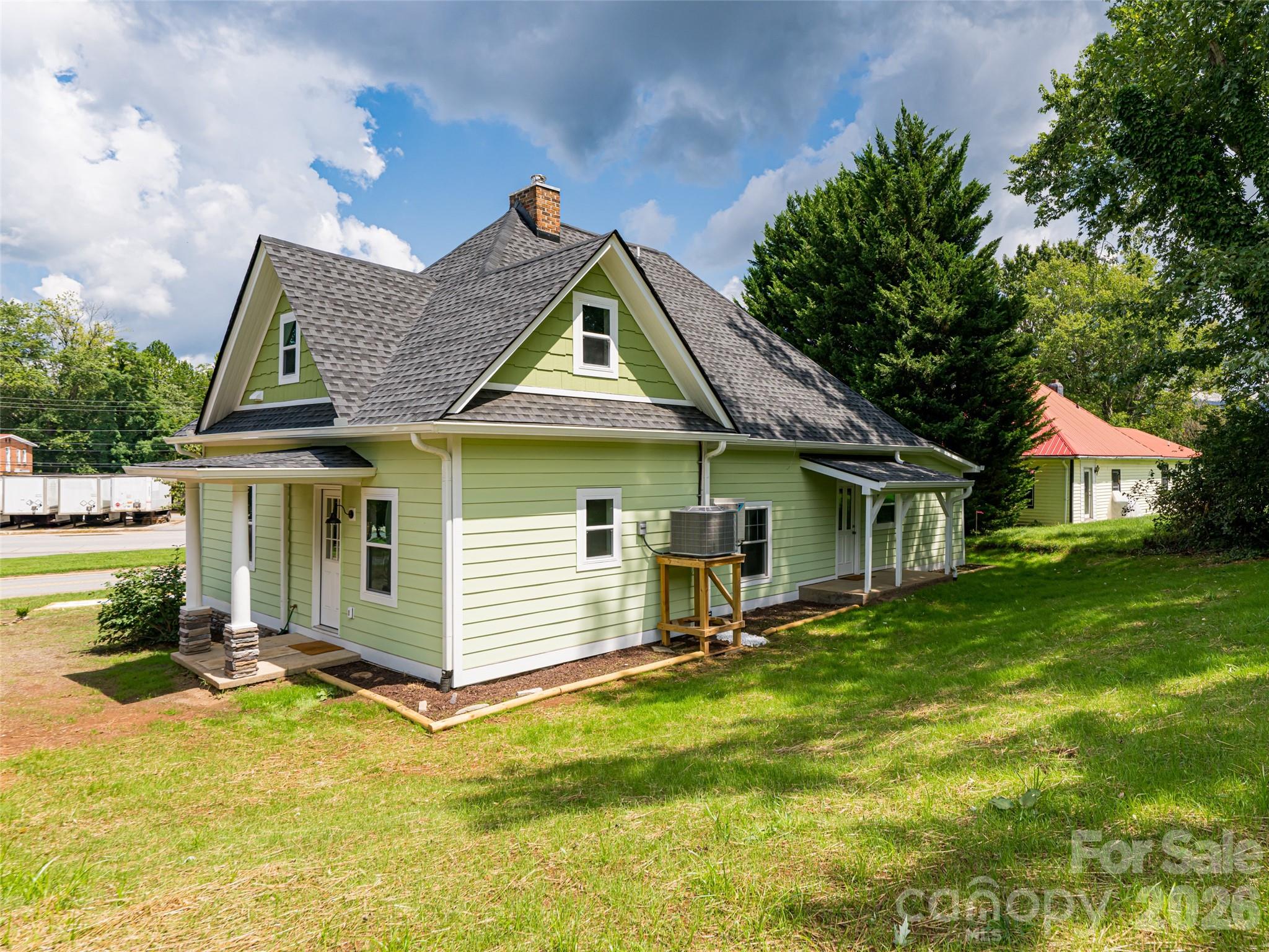172 Reed Street Canton, NC 28716 - Photo 40 of 48 a front view of a house with a yard