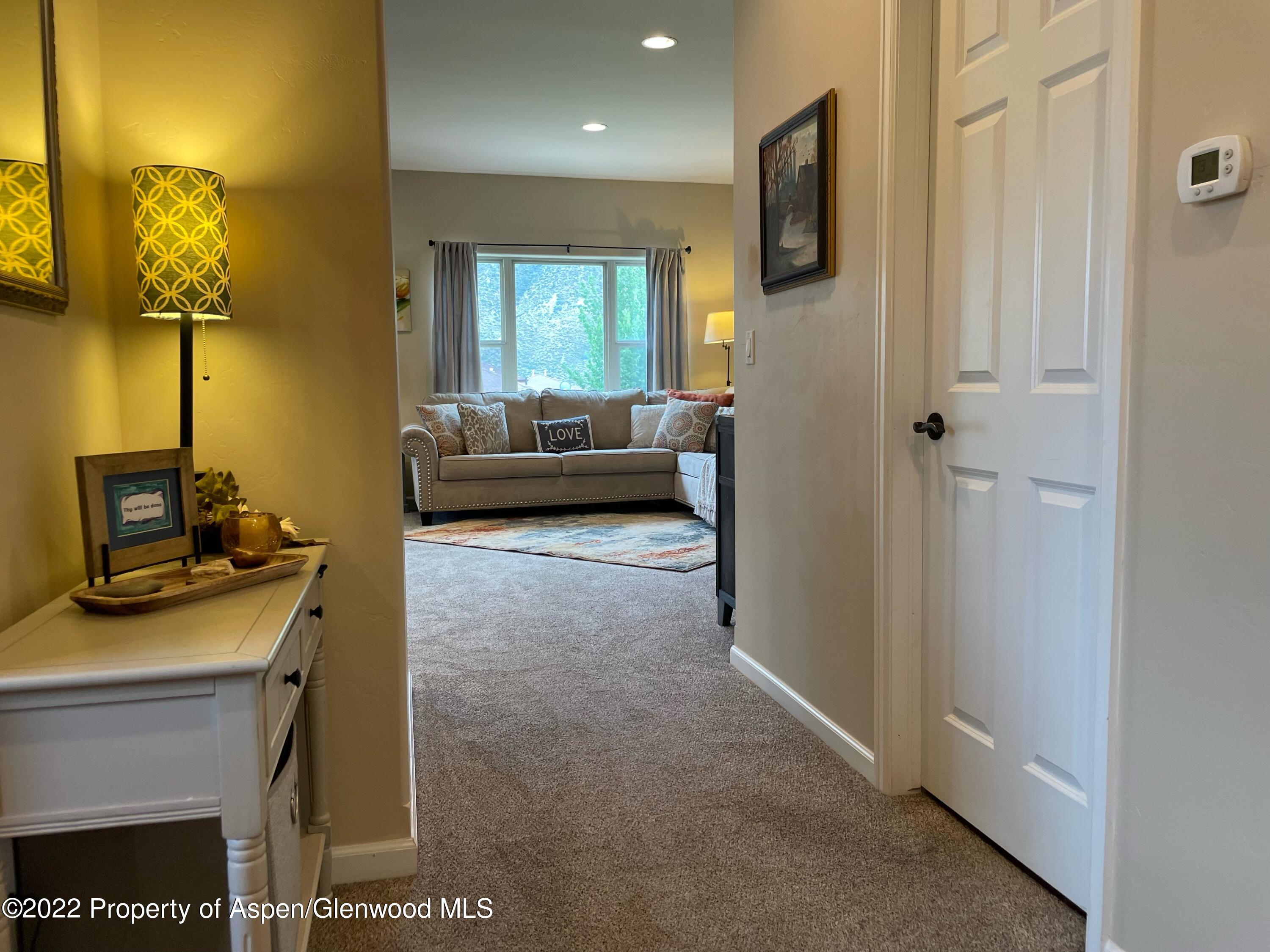 133 Castle Ridge Drive New Castle, CO 81647 - Photo 13 of 32 a living room with furniture and a flat screen tv