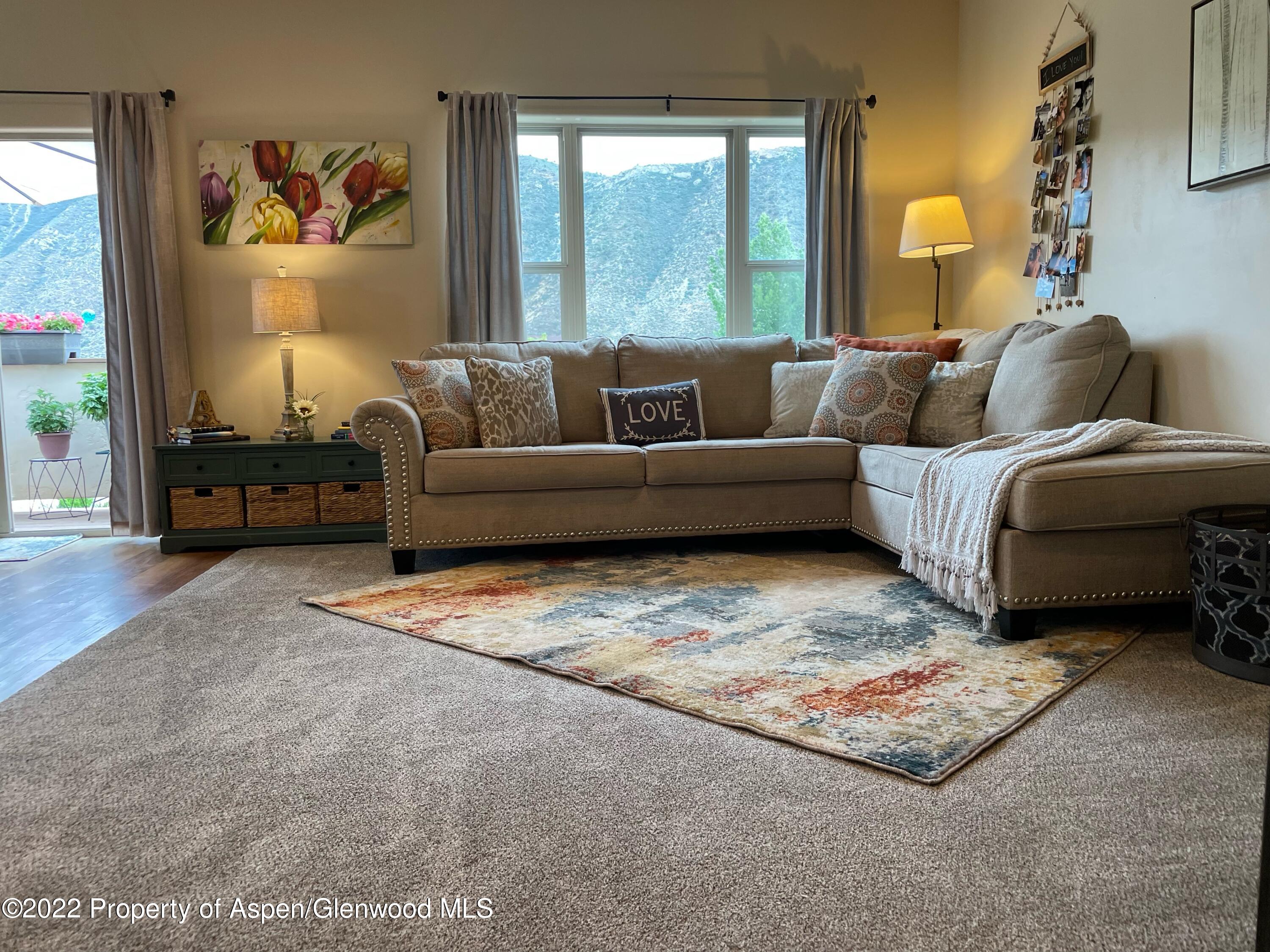 133 Castle Ridge Drive New Castle, CO 81647 - Photo 14 of 32 a living room with furniture and a large window