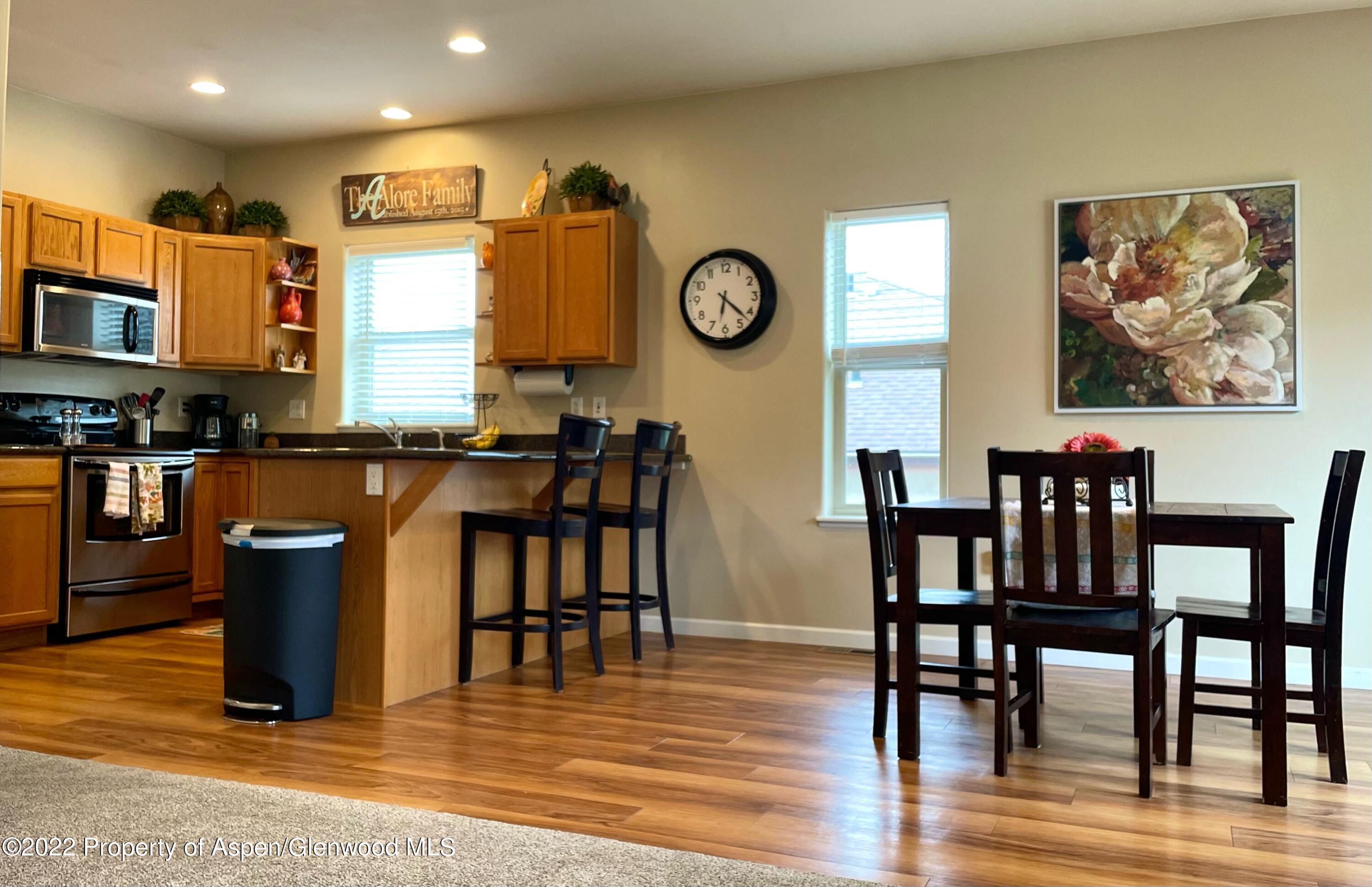 133 Castle Ridge Drive New Castle, CO 81647 - Photo 17 of 32 a view of a dining room with furniture and wooden floor