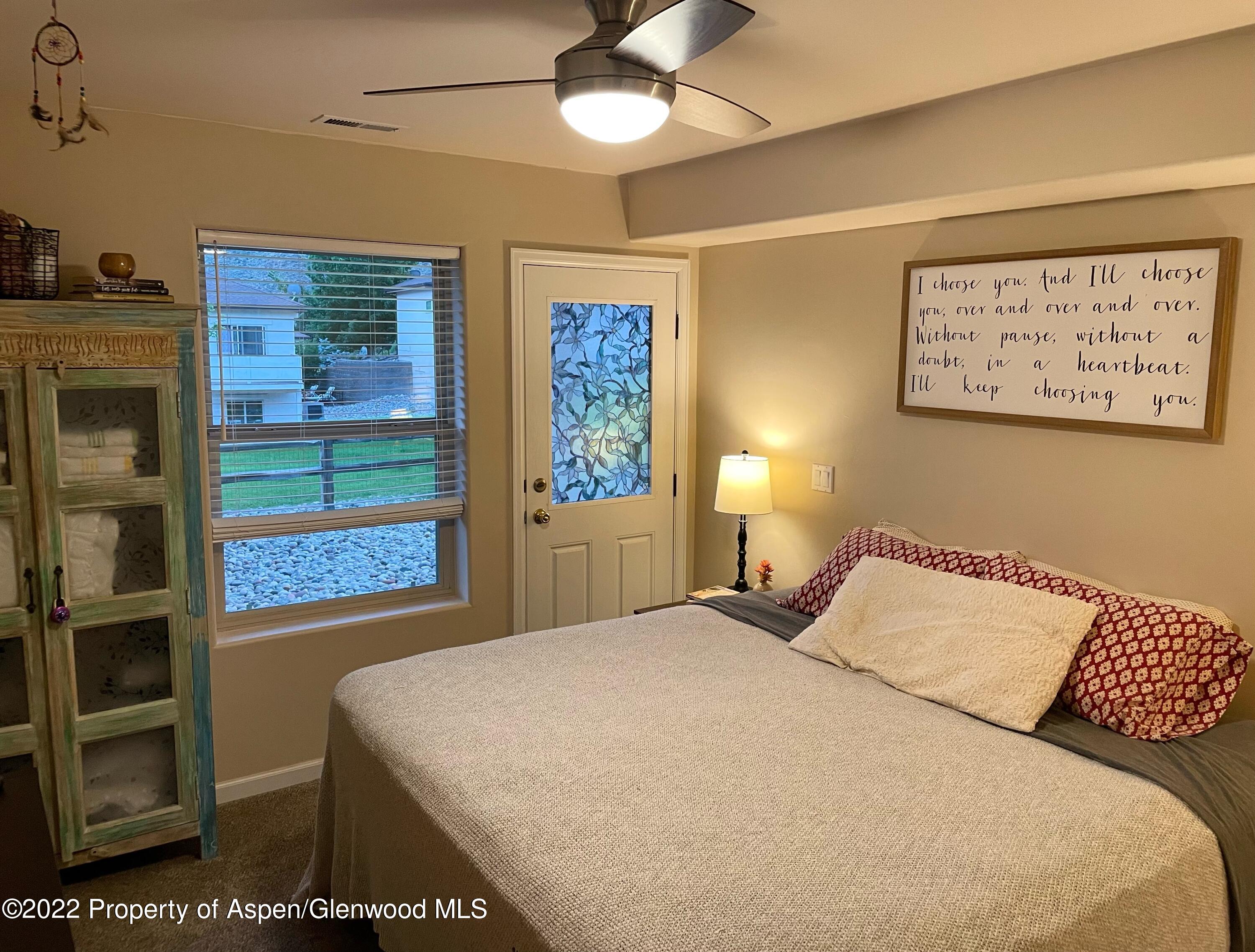 133 Castle Ridge Drive New Castle, CO 81647 - Photo 26 of 32 a bedroom with a bed and a window