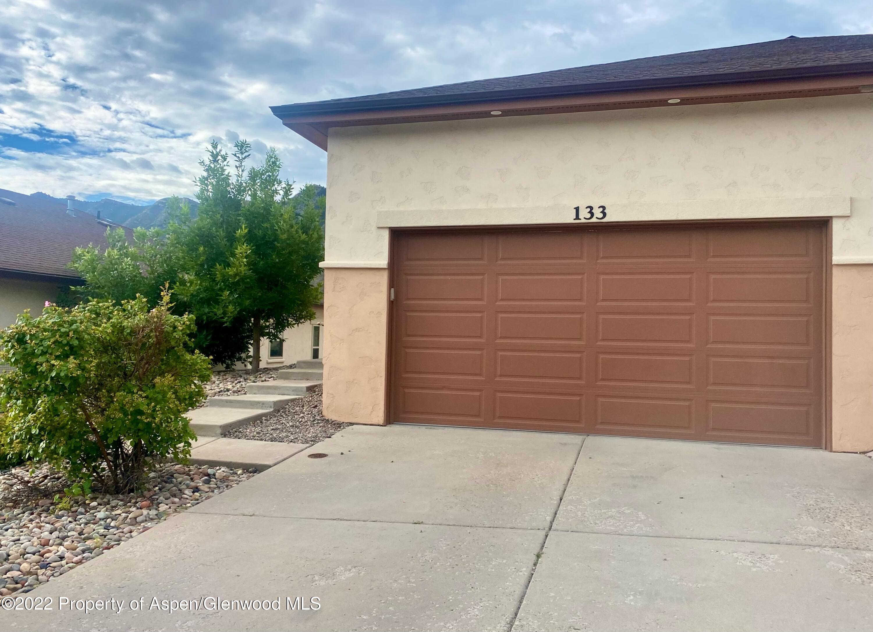 133 Castle Ridge Drive New Castle, CO 81647 - Photo 7 of 32 a couple of potted plants in front of door