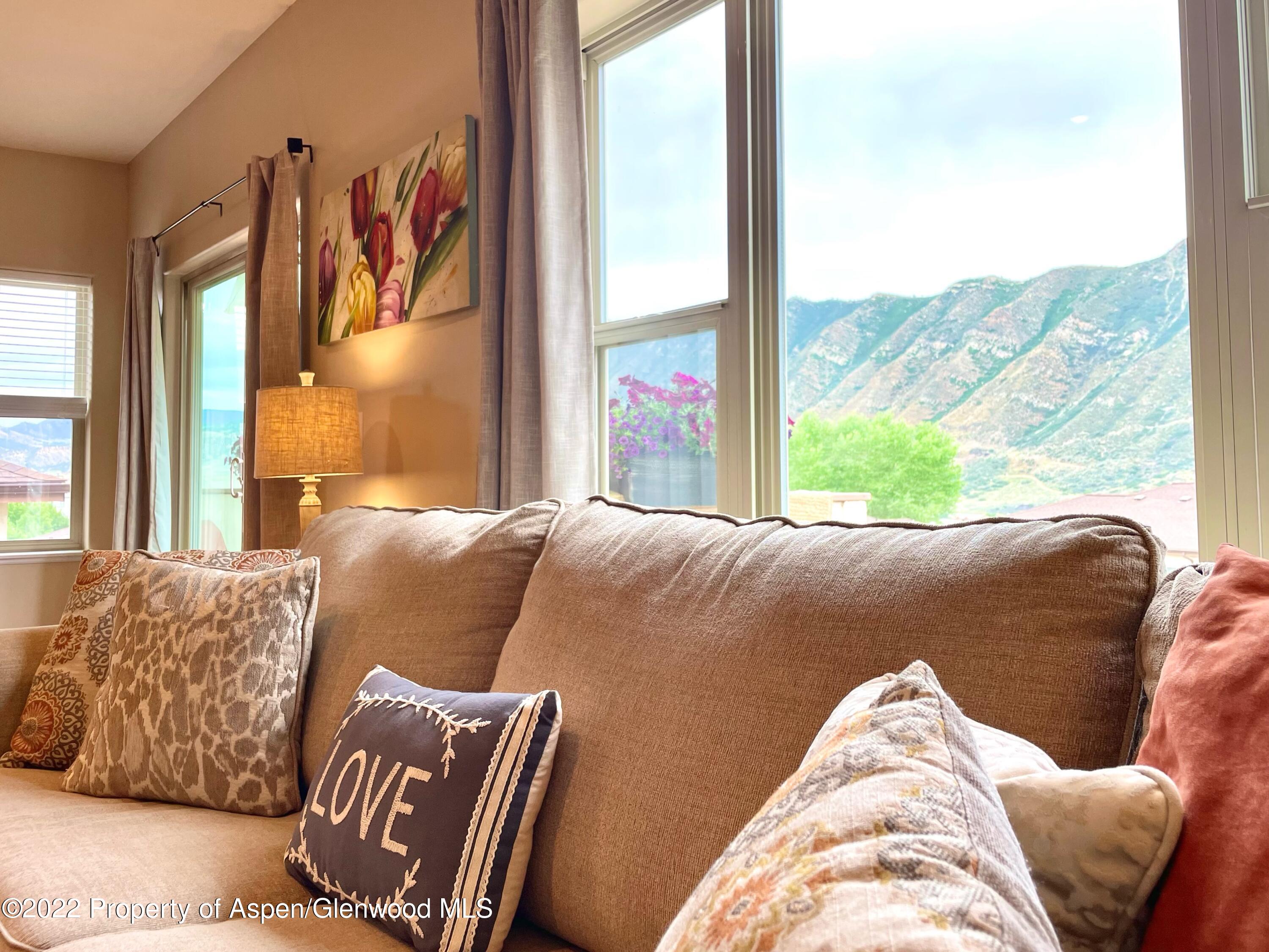 133 Castle Ridge Drive New Castle, CO 81647 - Photo 8 of 32 a living room with a couch and a large window