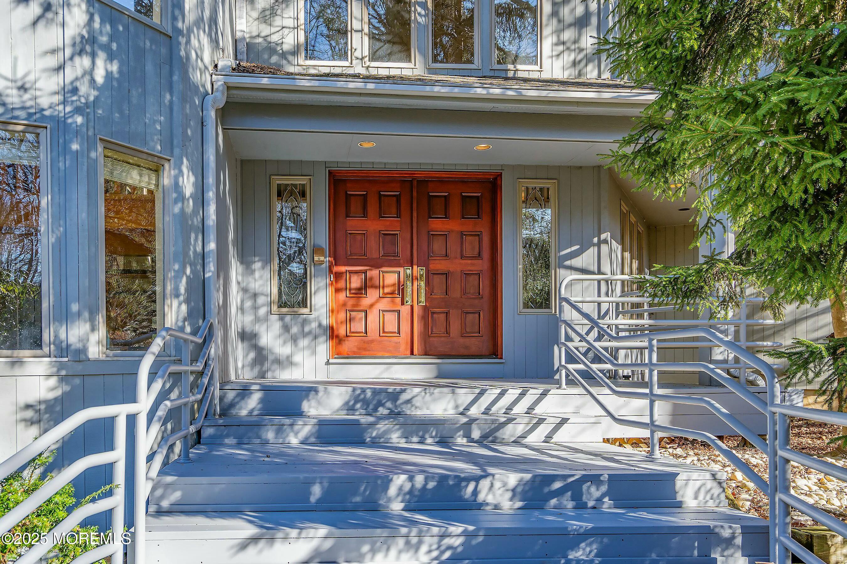 7 Jayhawk Way Holmdel, NJ 07733 - Photo 2 of 60 a front view of a house with glass windows