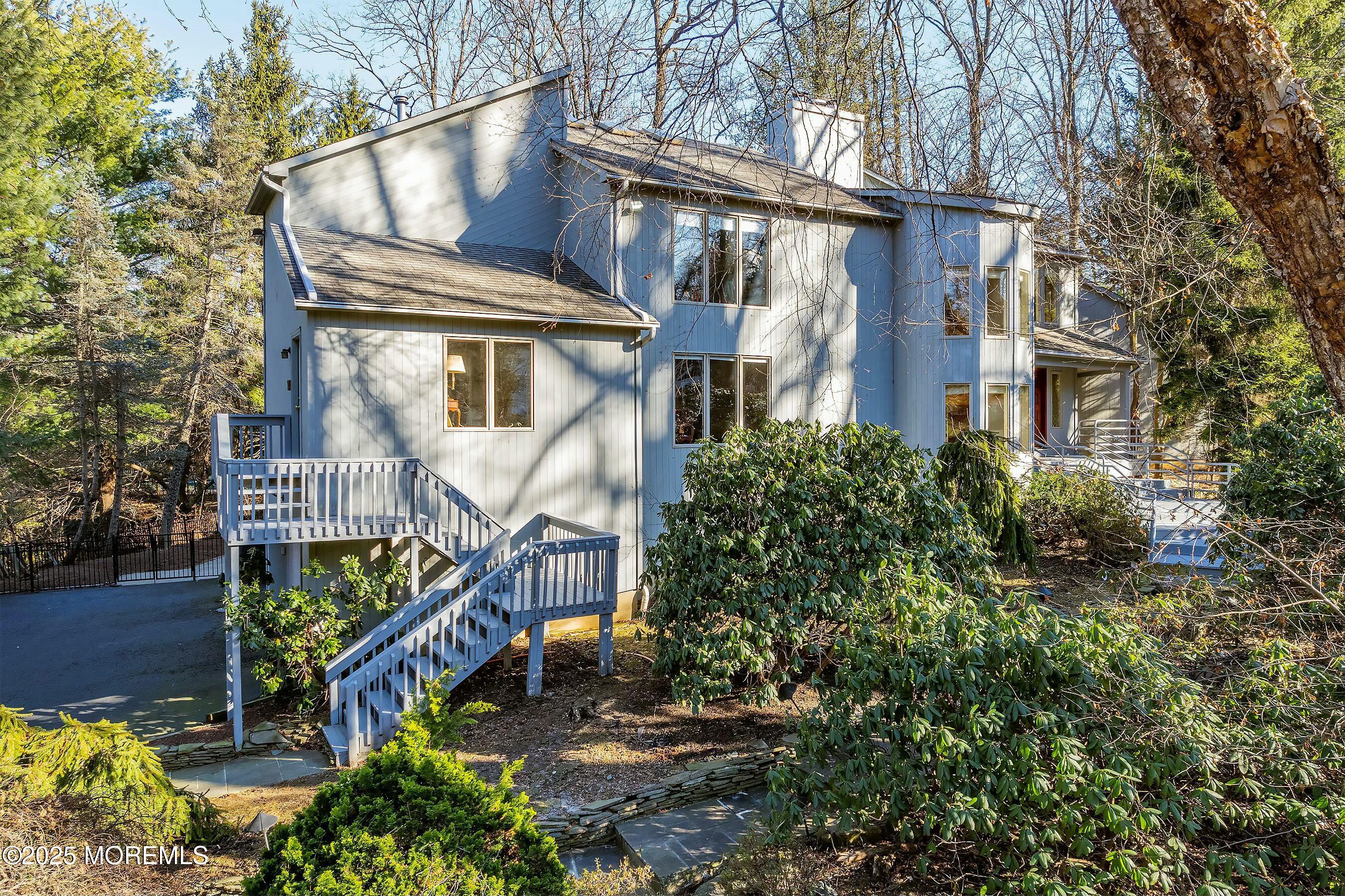 7 Jayhawk Way Holmdel, NJ 07733 - Photo 3 of 60 a view of a house with brick walls and flower plants